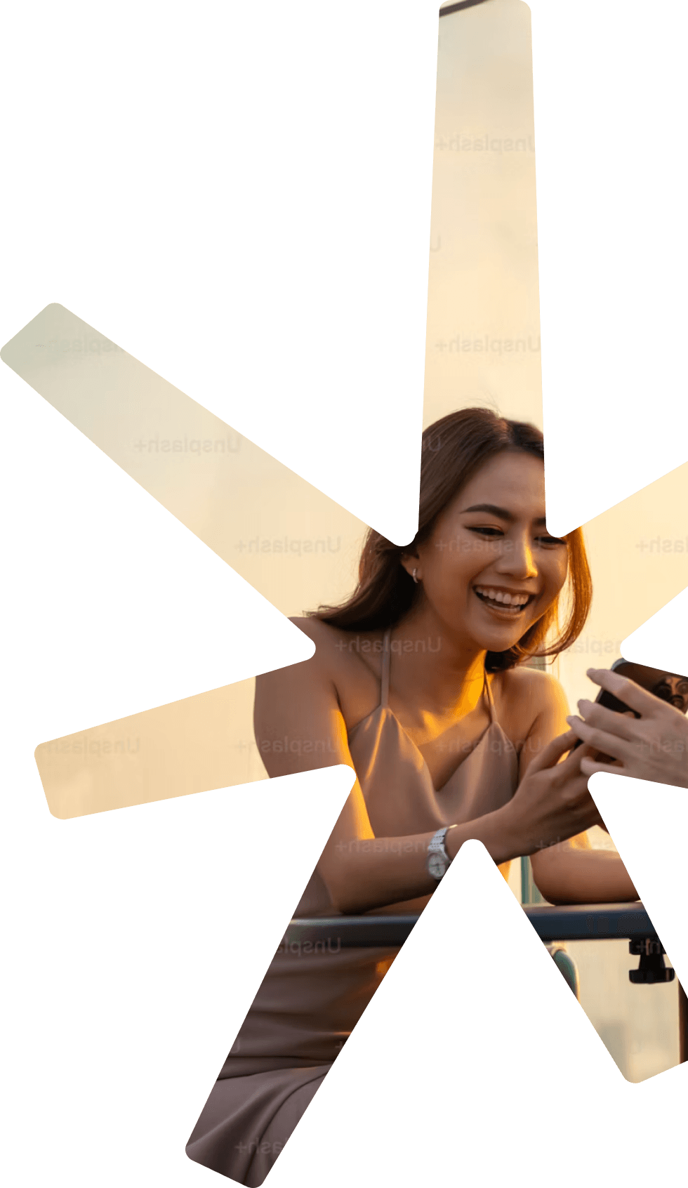Woman smiling while using her phone
